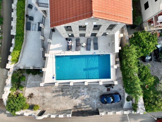 Stone villa and mini-hotel on the seashore in the Bay of Kotor in Montenegro