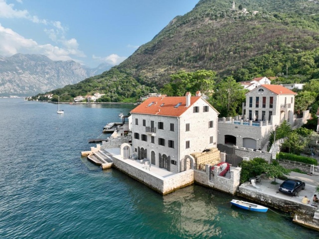 Stone villa and mini-hotel on the seashore in the Bay of Kotor in Montenegro