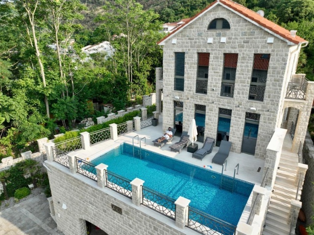 Stone villa and mini-hotel on the seashore in the Bay of Kotor in Montenegro