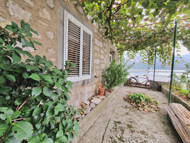 Stone house on the first line of the sea in Bay of Kotor