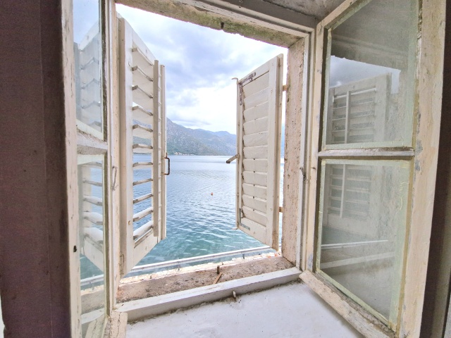 Stone house on the first line of the sea in Bay of Kotor