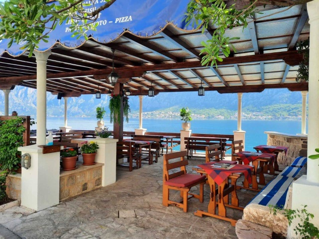 Two stone houses with a restaurant on the first line of the sea