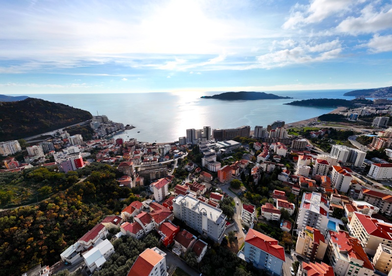 Luxury penthouse with panoramic sea views, rooftop terrace.