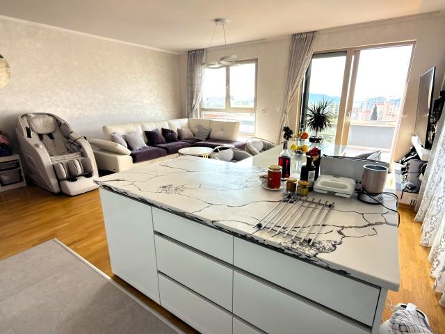 Luxury penthouse with panoramic sea views, rooftop terrace.