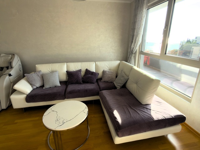 Luxury penthouse with panoramic sea views, rooftop terrace.