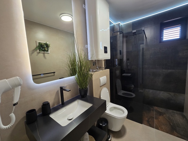 For sale is a completely renovated three-story hotel in the  Budva